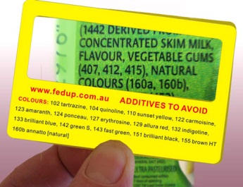 Magnifying failsafe card with names and numbers of additives to avoid